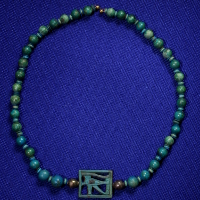 An Egyptian Faience and Silver Necklace